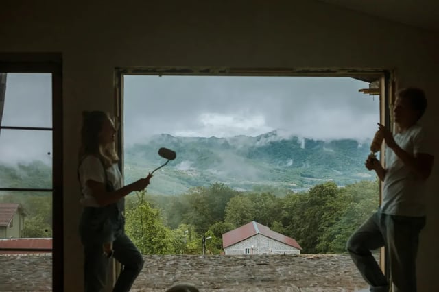 Couple painting a room