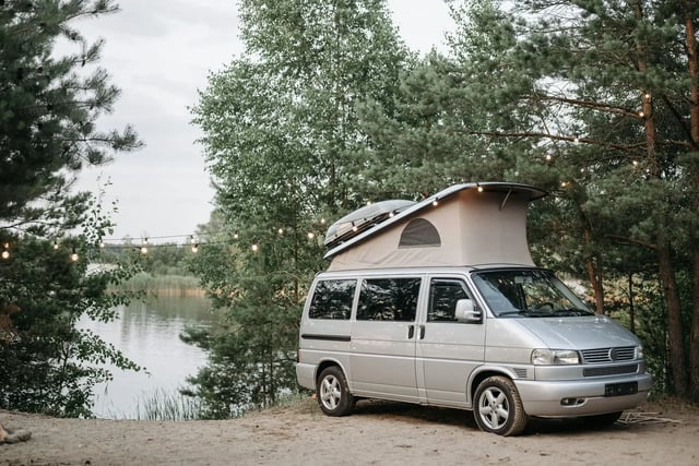 Campervan parked by a lake